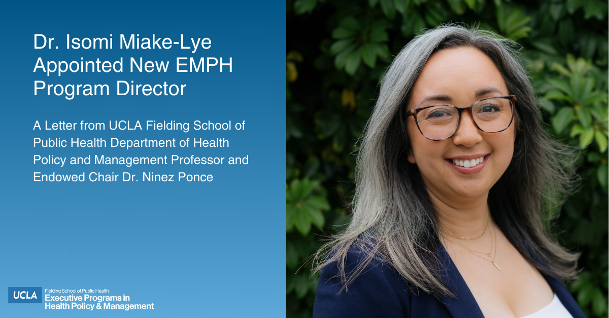 A professional photograph of Dr. Isomi Miake-Lye standing outside in front of a backdrop of lush green plants. She has long, graying hair, wears clear-rimmed eyeglasses, and is smiling directly at the camera. She is wearing a dark blue blazer over a white top. Text overlaid on the left side of the image reads: "Dr. Isomi Miake-Lye Appointed New EMPH Program Director," followed by "A Letter from UCLA Fielding School of Public Health Department of Health Policy and Management Professor and Endowed Chair Dr. Ninez Ponce." The bottom left corner includes the UCLA Fielding School of Public Health Executive Programs in Health Policy & Management logo.