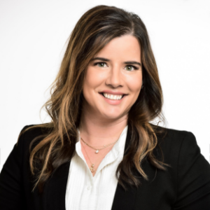 Professional headshot of Alicia Macklin, JD, MPH, who lectures in the Legal Environment of Health Services Management course in the Executive MPH program at the UCLA Fielding School of Public Health. She is smiling and wearing a black blazer over a white collared shirt.