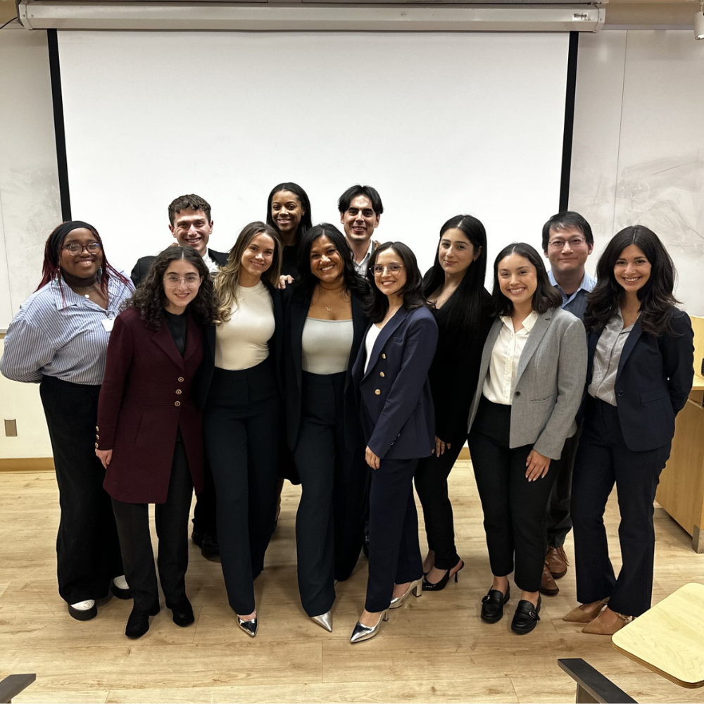 group photo inside a UCLA lecture hall of the EMPH Class of 2026