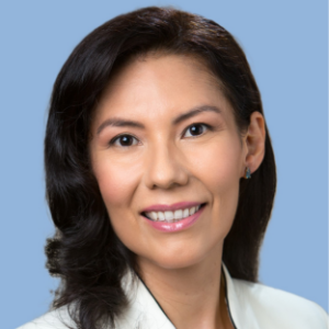 Headshot of UCLA EMPH student Dr. Martha Vega. She has shoulder length straight black hair and she is wearing a white physician coat